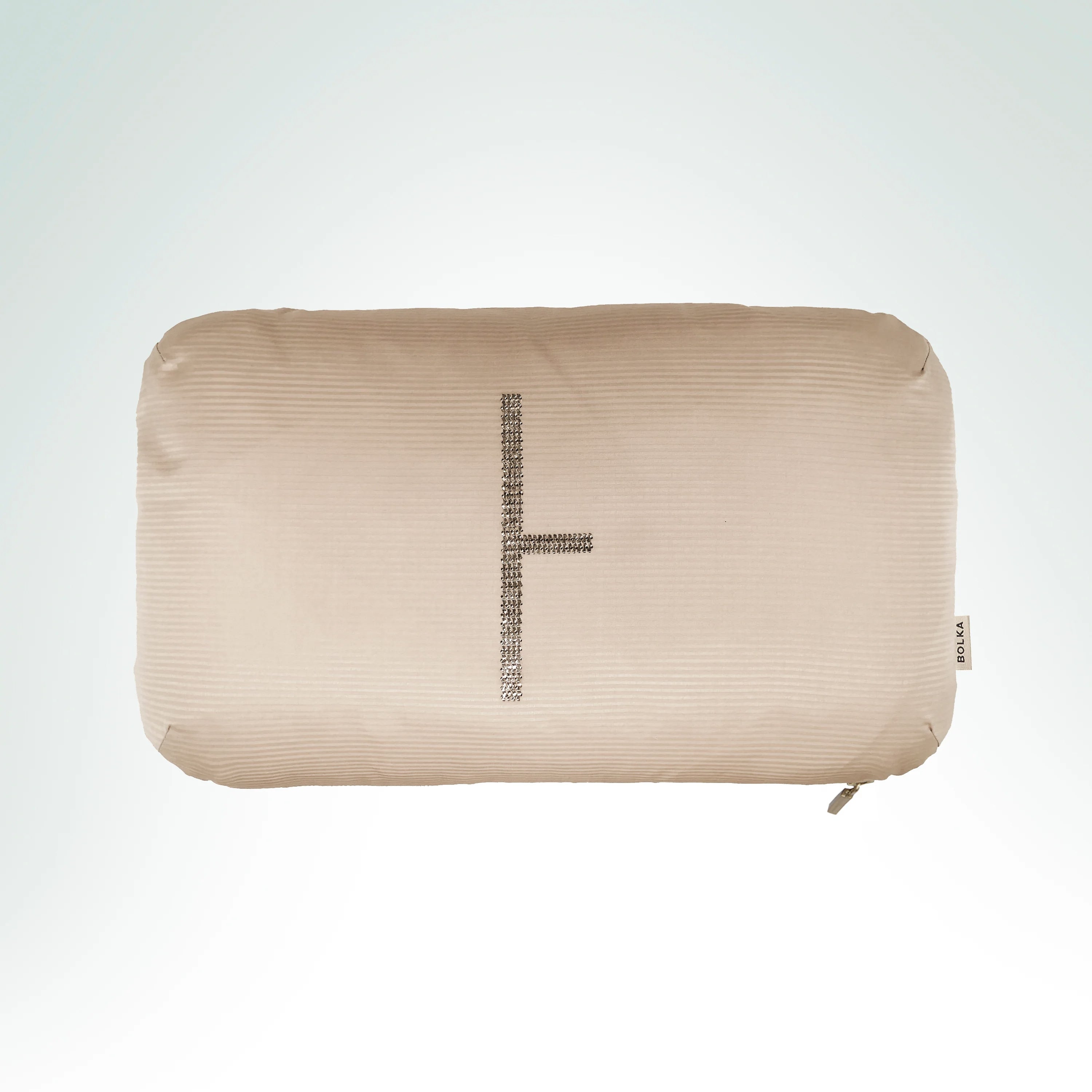 Hand-embroidered hand-loomed beige silk cushion featuring the Birch Ogham symbol with silver metal thread