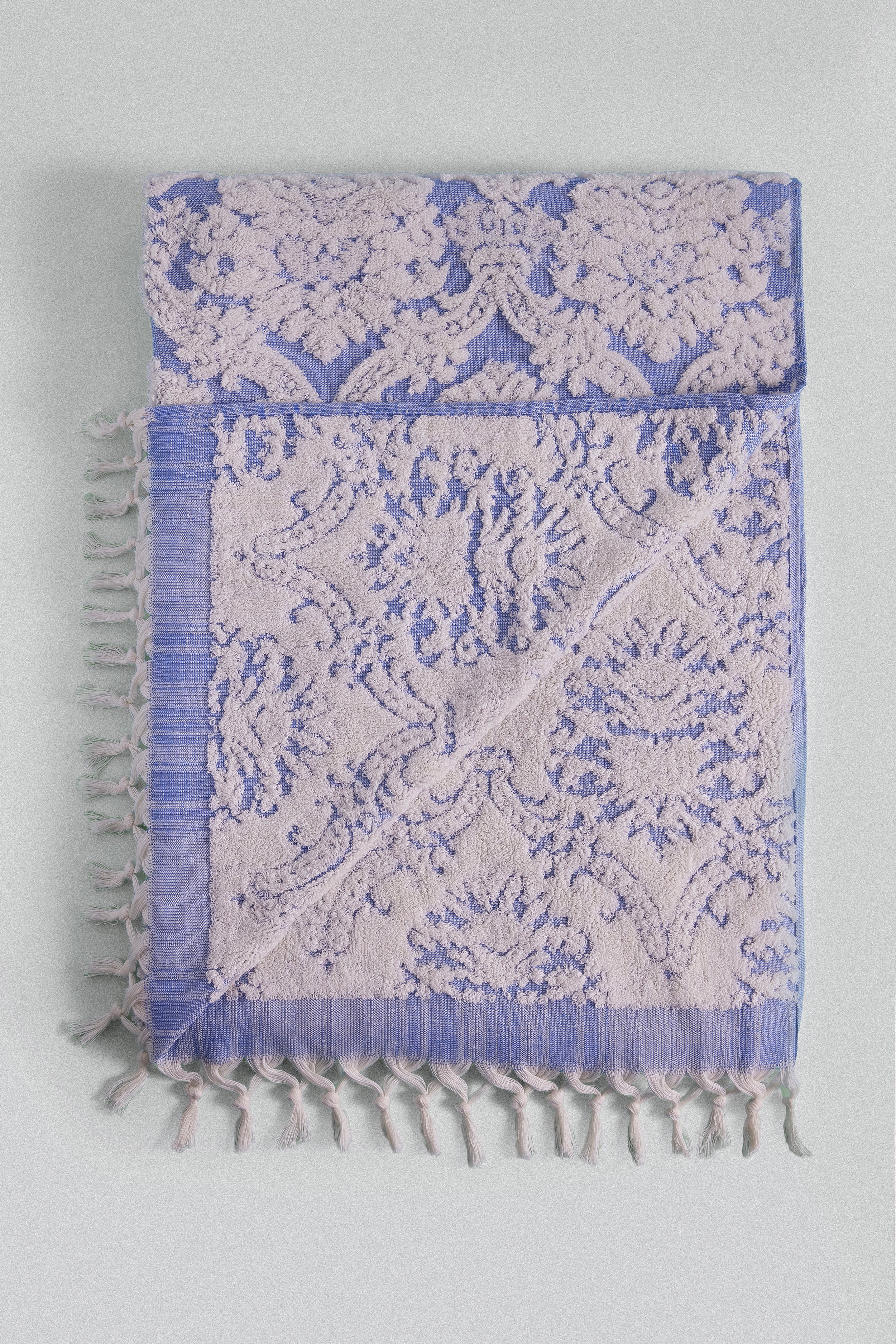 Carnation soft Turkish cotton bath towel in blue jacquard inspired by Ottoman floral motifs. 