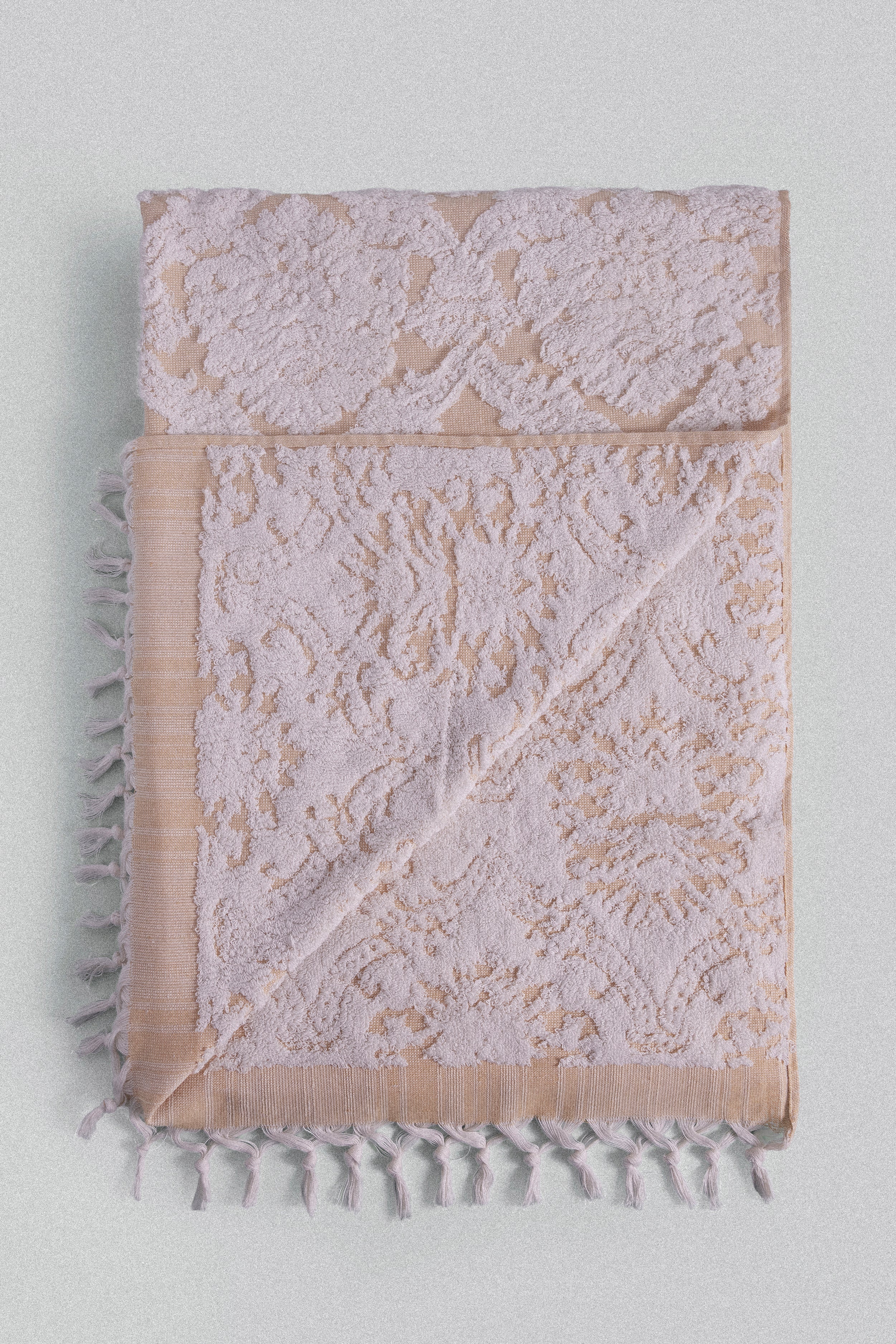 Carnation jacquard Turkish cotton bath towel in saffron yellow inspired by Ottoman floral motifs.