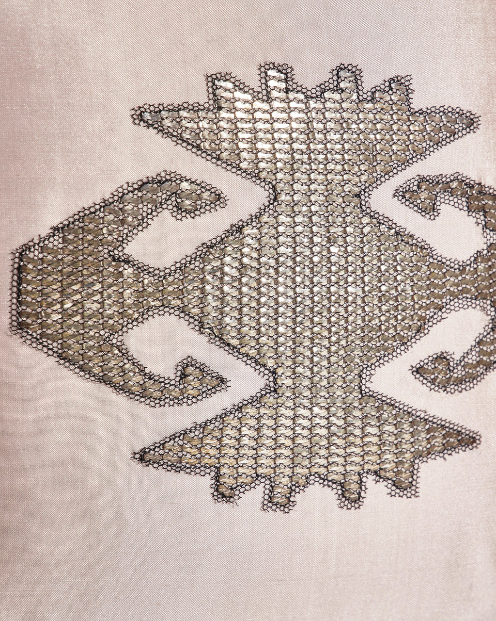 Close-up of silver metallic hands-on-hips (elibelinde) embroidery on pink Indian dupion silk cushion