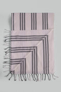 Striped black-and-white light Turkish towel peshtemal with tassels.