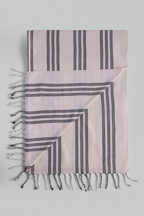 Striped black-and-white light Turkish towel with tassels.