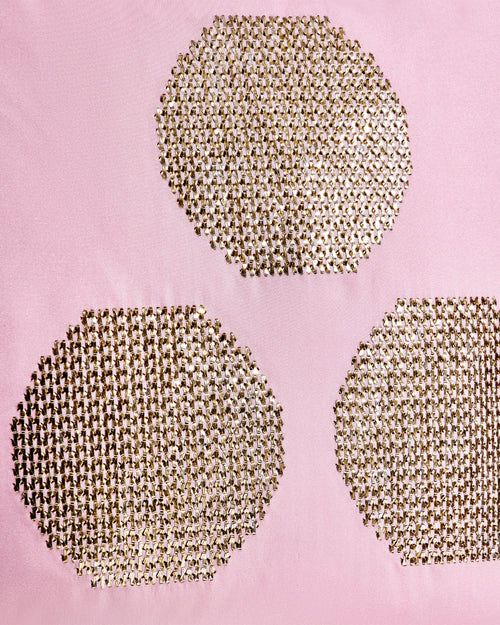 Hand-embroidered chintamani motif with gold thread on pink silk taffeta.