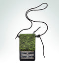 Leather crossbody phone pouch with a zebra-print pistachio pocket and a shiny black leather body.